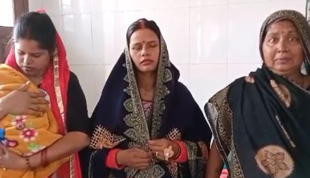 Women in traditional attire standing together.
